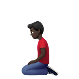 klęczący mężczyzna: karnacja ciemna