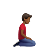 klęczący mężczyzna: karnacja średnio ciemna i zwrócony w prawo