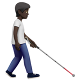 osoba z białą laską: karnacja ciemna i zwrócony w prawo